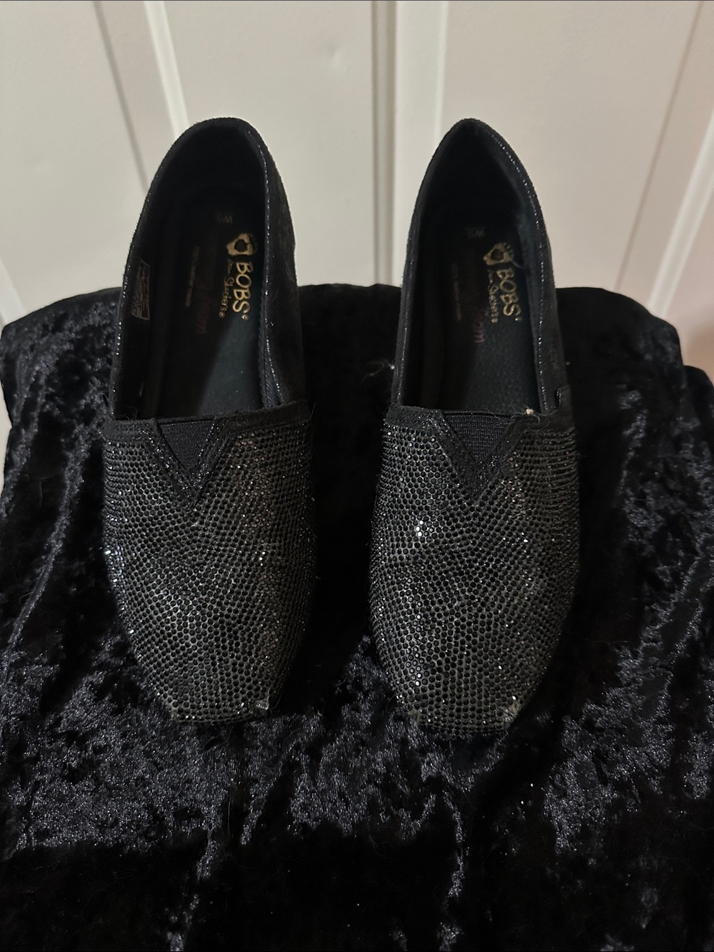 Bobs from Skechers slip on flats.  Memory foam. 100 percent leather insole.